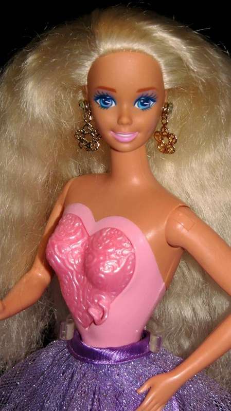 Locket Surprise Barbie doll made by Mattel