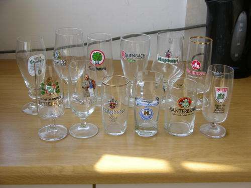 12 X 1/2pt Glasses from England -Mainly German beers Very collectable