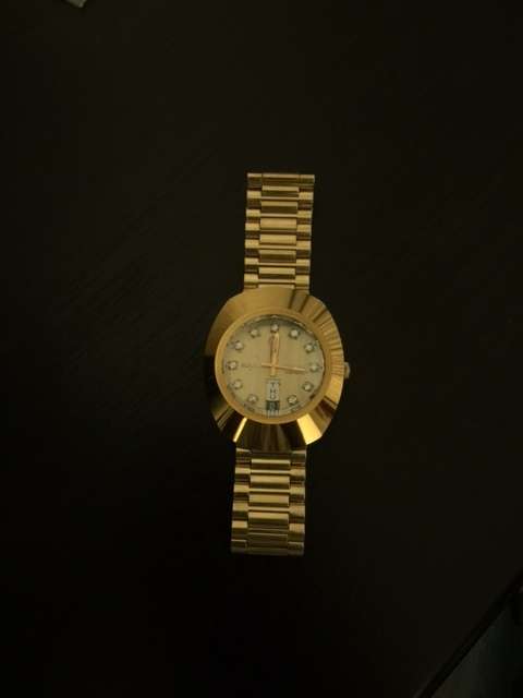 rado diastar gold plated with dimaonds