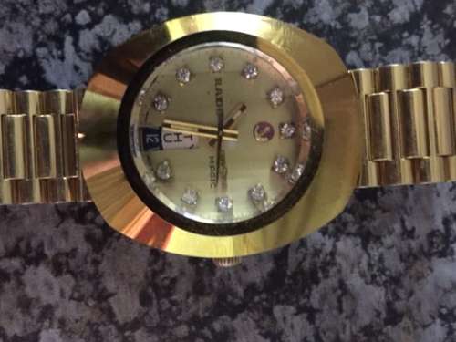 rado diastar gold plated with dimaonds