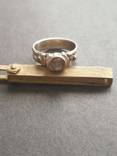 silver ring with a smokey stones stamp 926