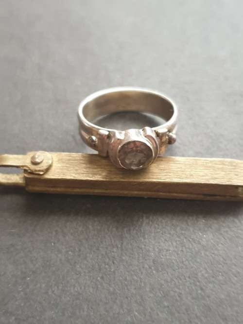 silver ring with a smokey stones stamp 926