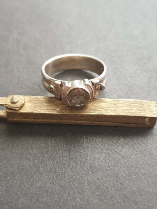 silver ring with a smokey stones stamp 926