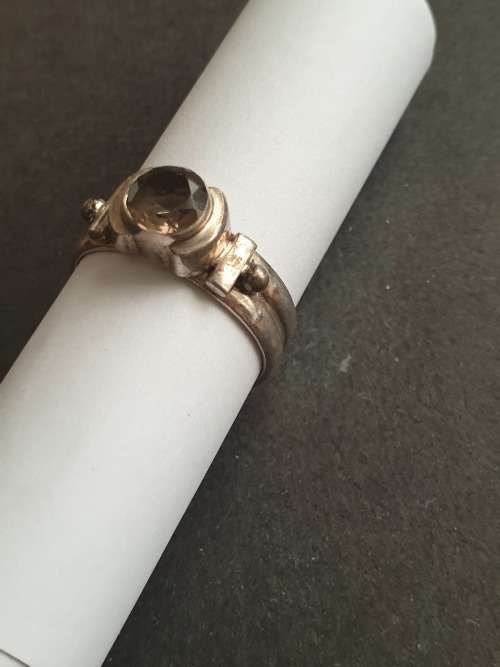 silver ring with a smokey stones stamp 926