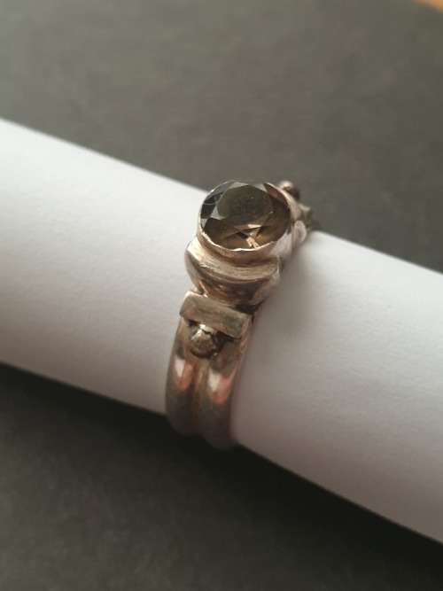 silver ring with a smokey stones stamp 926
