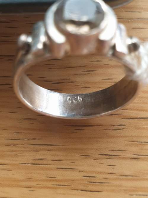 silver ring with a smokey stones stamp 926