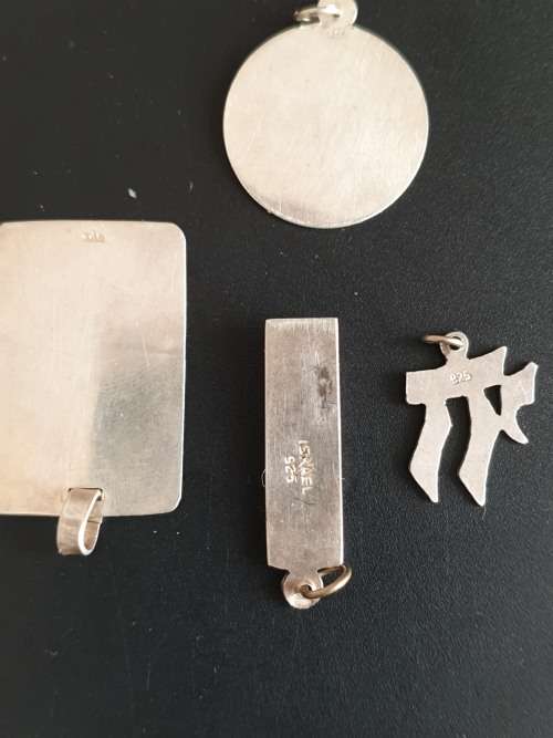 4 silver pendants sold as a job lot