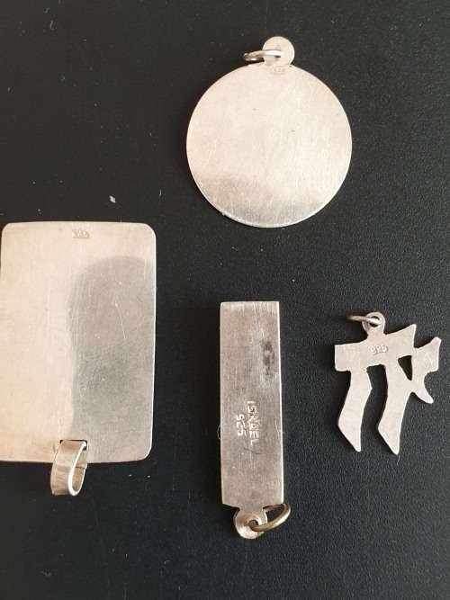 4 silver pendants sold as a job lot