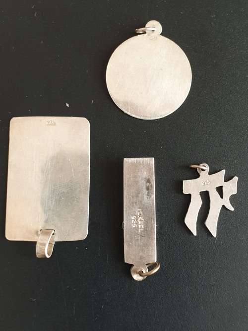 4 silver pendants sold as a job lot