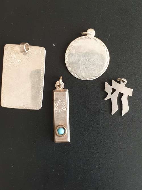 4 silver pendants sold as a job lot