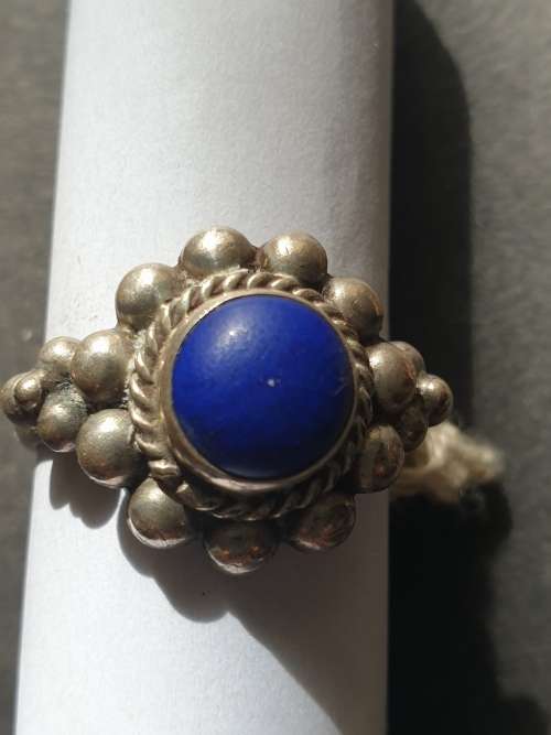 silver ring with a blue stones stamp 925