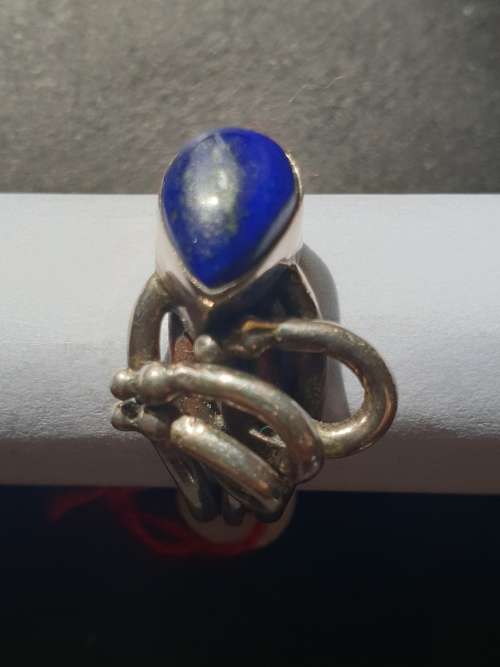 A sliver ring with blue stones oval cut stone