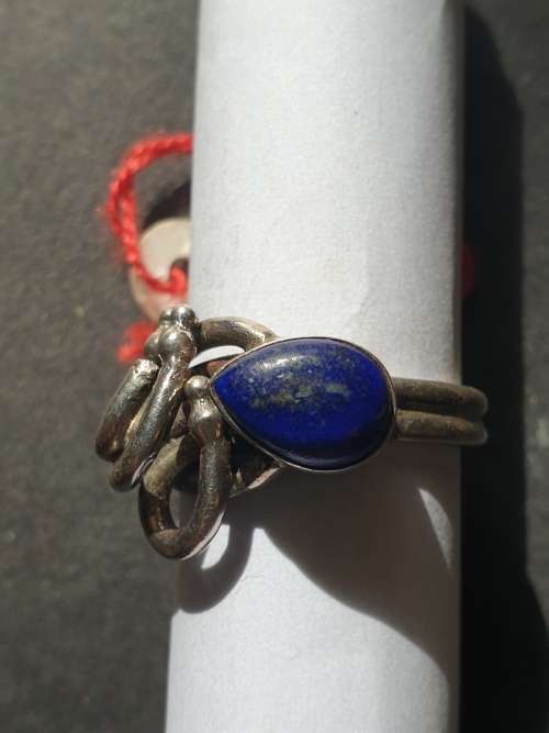 A sliver ring with blue stones oval cut stone