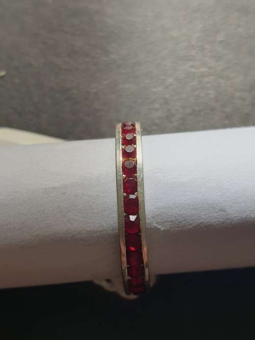 eternity ring with red stones