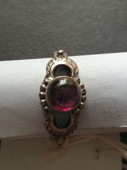 silver ring with a red stones stamp 925