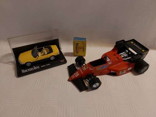 Ferrari racing car (  made in italy ) and one Mercedes benz car (600SL (1992)