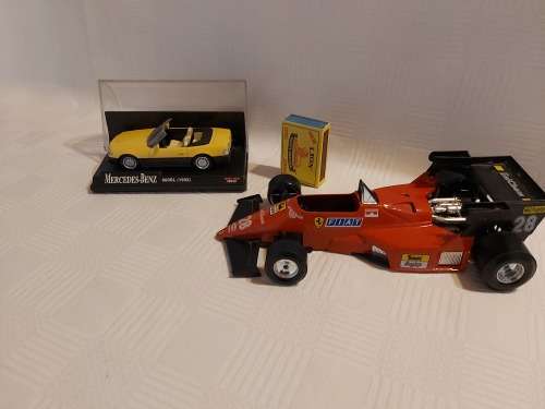 Ferrari racing car (  made in italy ) and one Mercedes benz car (600SL (1992)