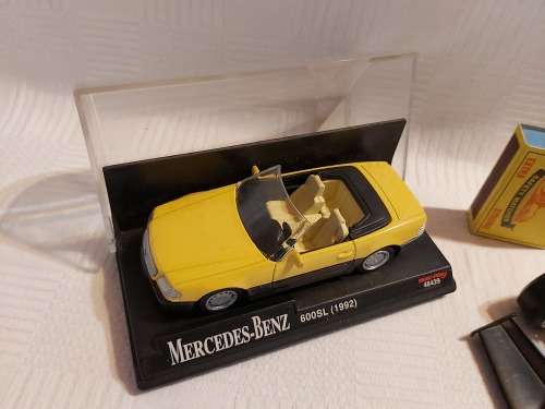 Ferrari racing car (  made in italy ) and one Mercedes benz car (600SL (1992)