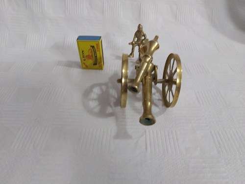 Brass cannon with soldier