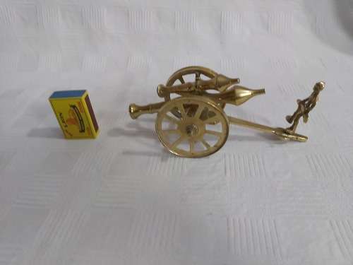Brass cannon with soldier