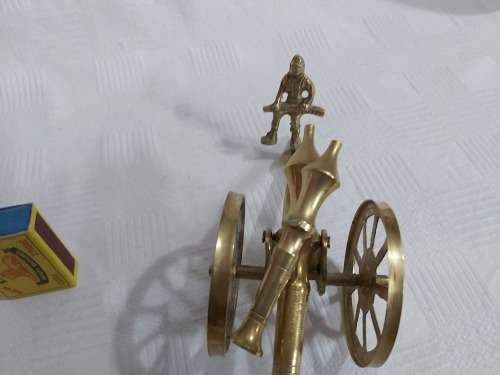 Brass cannon with soldier