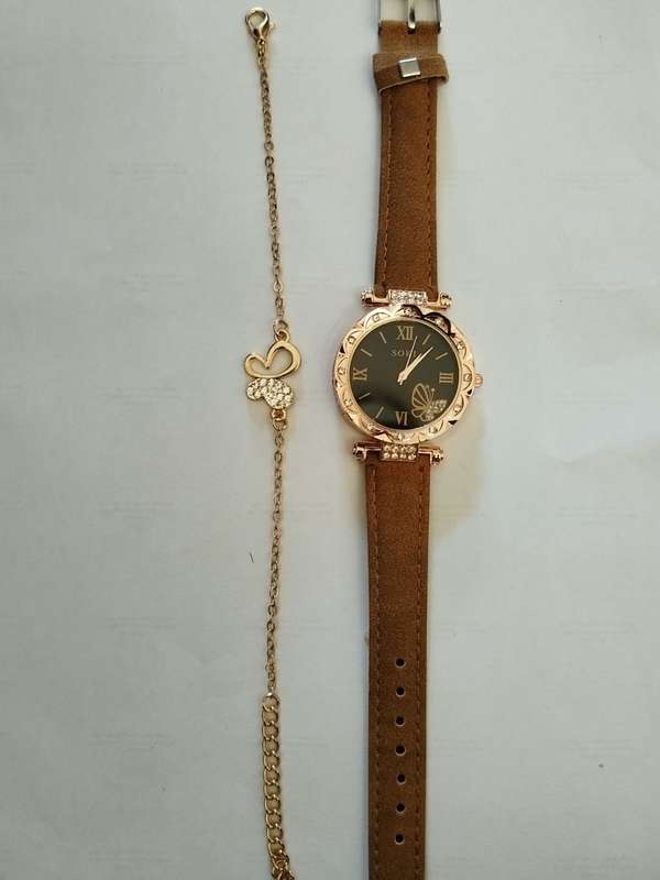Stunning butterfly bracelet with brown watch.