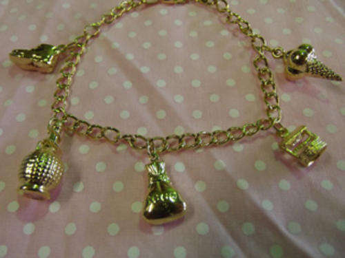 GENUINE 9CT GOLD CHARM BRACELET WITH 5CHARMS AND ***FREE COURIER SERVICE***