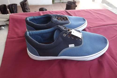 Pair of blue men's sneakers by Original in size 9.Bought too small.Never used.