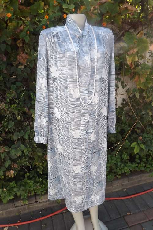 White and light blue shirt type shift dress tastefully printed.Size 46/22 by Rialto. Italian styled