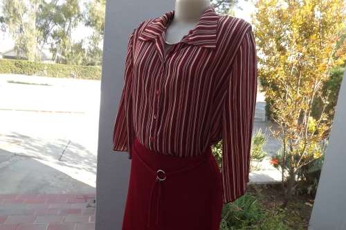 Eye catching striped polyester top in red,beige and brown.Size 40/16.Elbow length sleeves