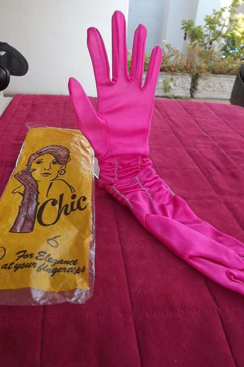 Pair of pink nylon gloves in size 7.5.New condition.By Chic