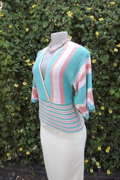 Acrylic knit top in soft pastel colours by Judy's Pride size 32/10.Wide middle ribbing.