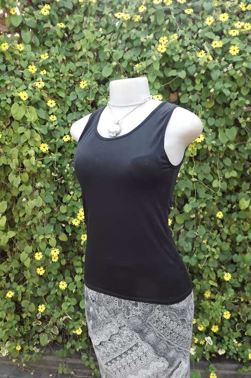 Lovely black lycra/nylon top with build in bra.Size 32/8.With tiny black floral pattern.Good cond