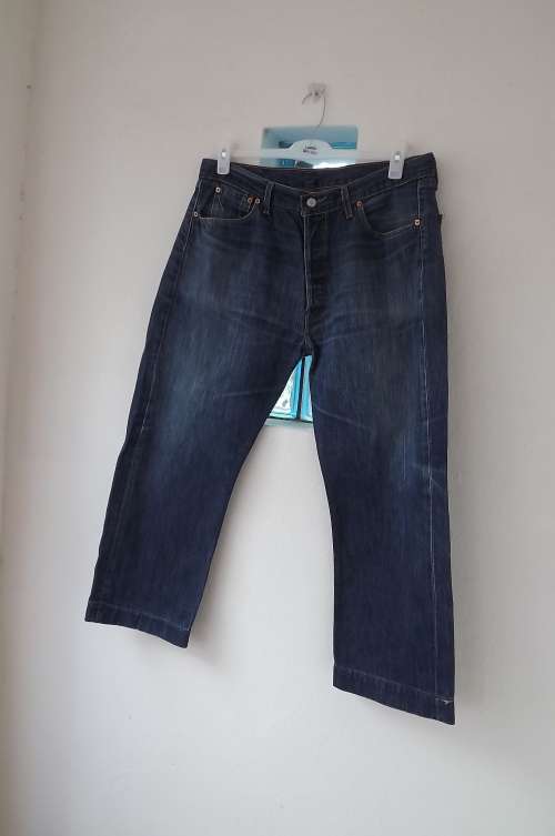 Genuine Levi men's jeans with hidden button fly Inner legs 67cm. Size 38.Good condition.See leg seam