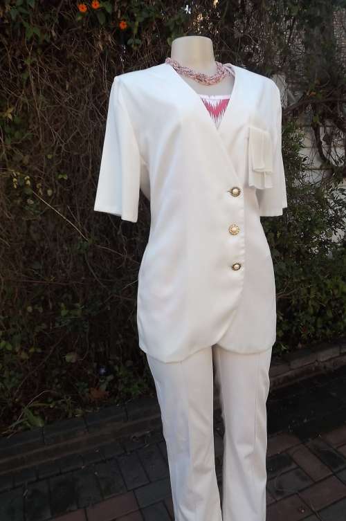 Classic white long styled jacket for summer in size 38/14 by Truworths.Good condition.