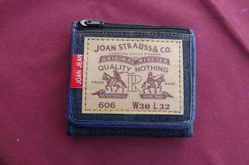 Small handy denim wallet by Joan Jean.Enough storing space 10x10cm. We have 2 in stock @R55 each