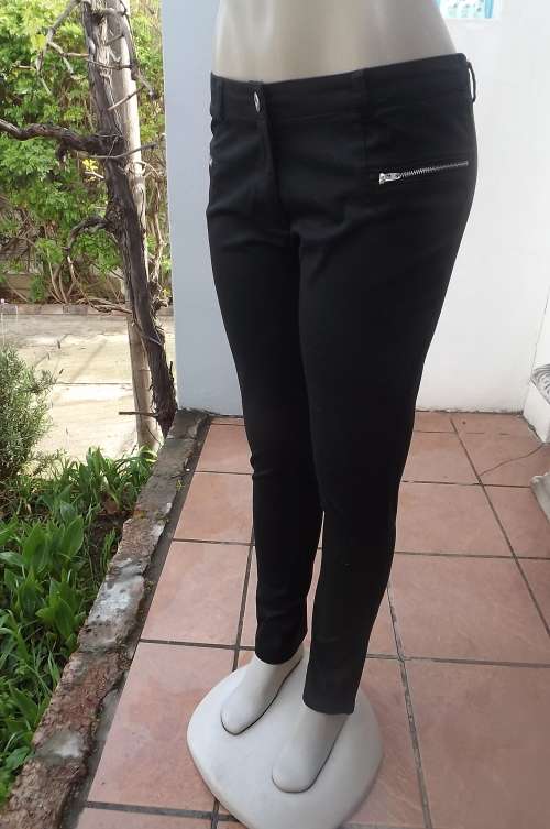 Skinny leg black stretch cotton RT pants in size 36/12.Two zipped dummy pockets on front.