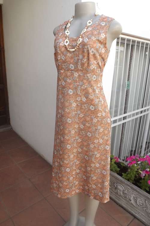 Vintage dress from the 80's made by owner.In size 38/14 with empire waist.Used but in fine condition