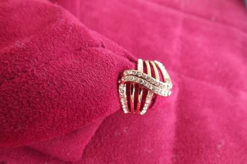 Stunning size 8 ring in a red tone with lots of imitation diamonds.New item