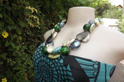 Modern bulky necklace with large striking blue and green colourful beads.Will transform your dress