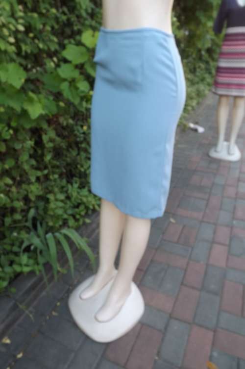 Pretty knee length sky blue band less pencil skirt with zip at back.In size 32/8 by EXACT