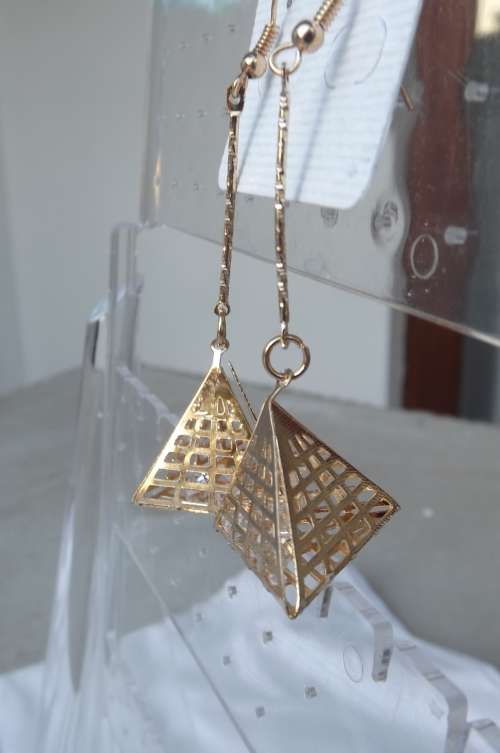 Pair of gold toned piramid dangle earrings.New item.Light weight