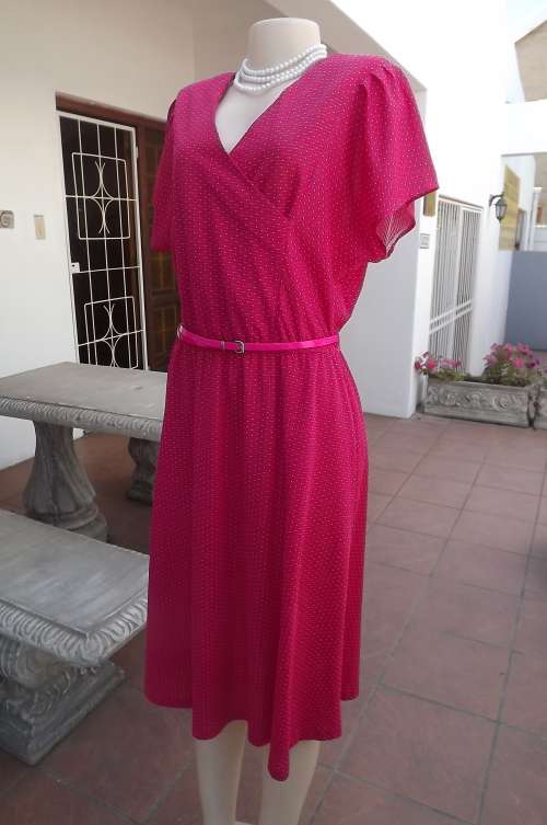 Cerise colour vintage dress with tiny white polkadots.Size 36/12.Cross over V front by PROFILE