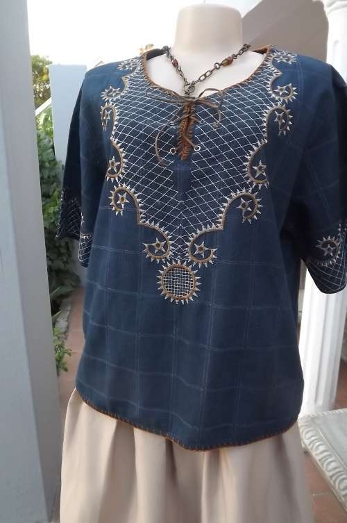 Blue denim box style top with silver and gold embroidery on front and sleeves.Size 42/18