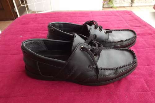 Pair of comfortable men's shoes in black size 8 by WOOLWORTHS with genuine leather uppers.