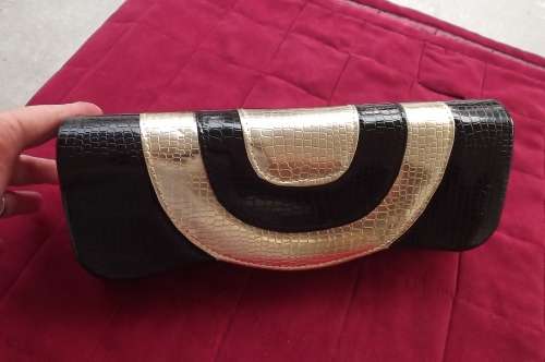 Patent leather look black and gold clutch bag for evening.Animal skin finish. 30x12cm.New