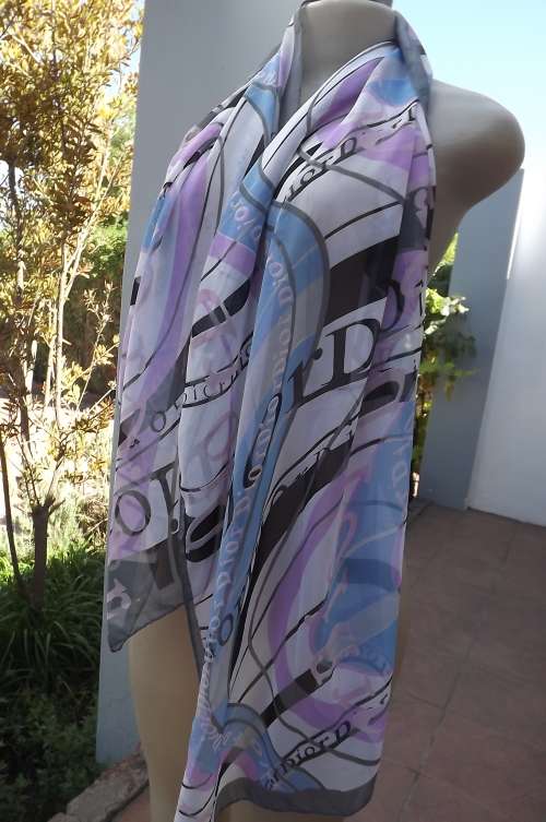 Stunning sheer scarf in white with violet and blue and black Dior logos.Length 160cm width 50cm