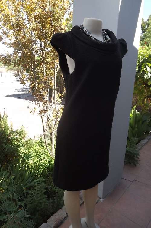 Fabulous textured woolen black dress size 35/11.Fully lined.Small capped sleeves.Roll neck collar