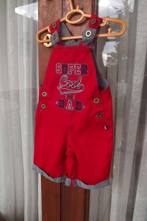 Beautiful SUPER COOL  LIKE DAD dungareee for 0-3 month old baby in red cotton with some blue.