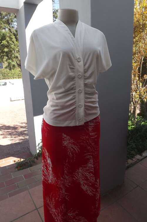 Sassy white button down top with covered buttons.V front.Size 33/9 by WITCH.Buttersoft polyester